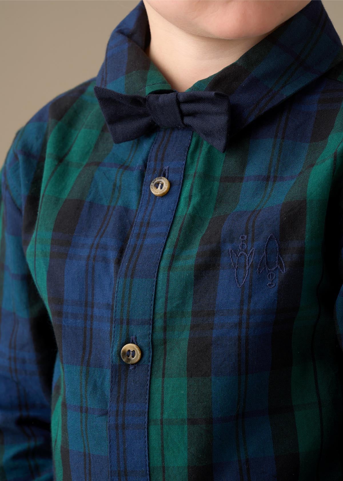 green boys plaid shirt with bow tie
