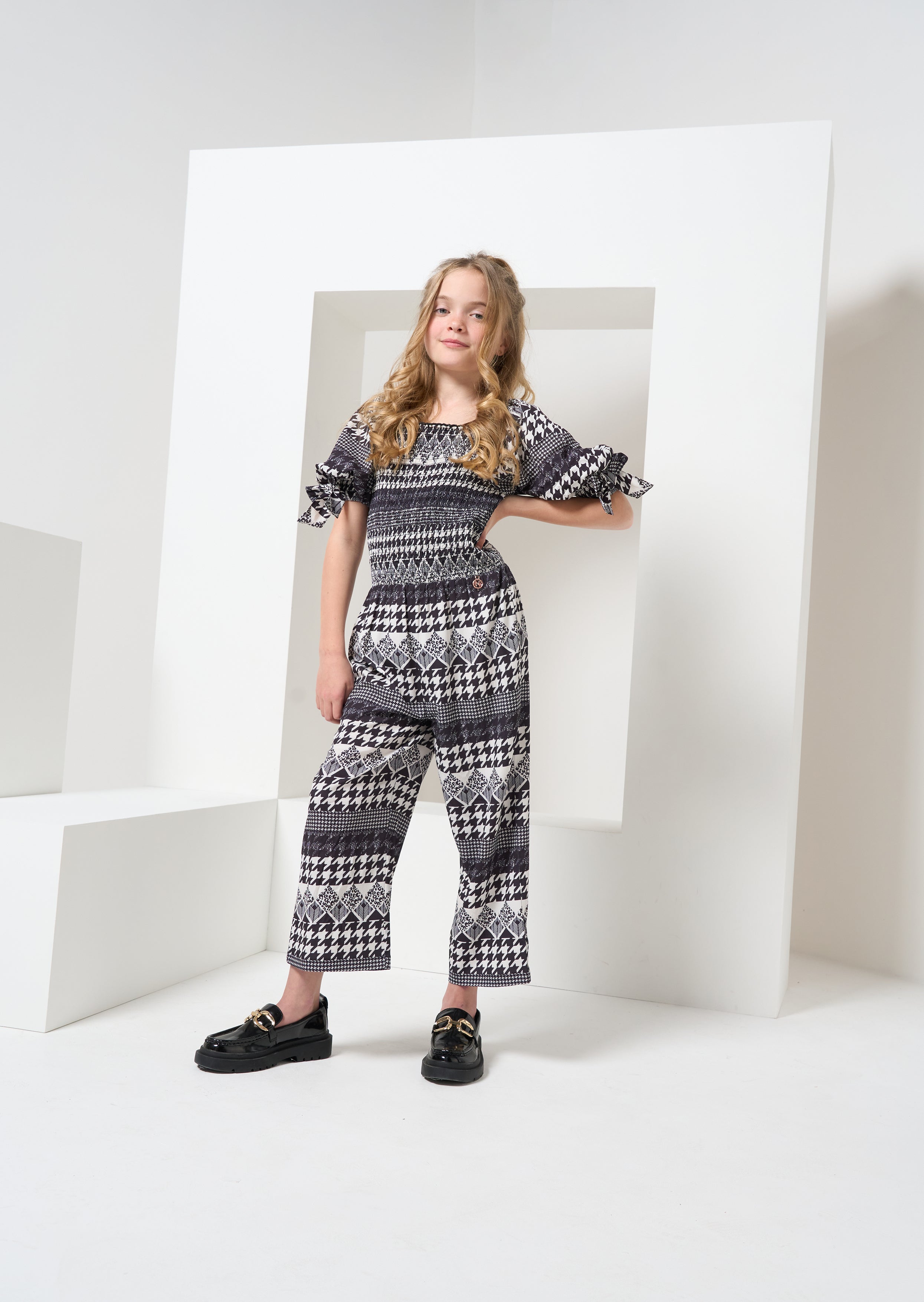 Girls Printed Black Jumpsuit with Puff Sleeves
