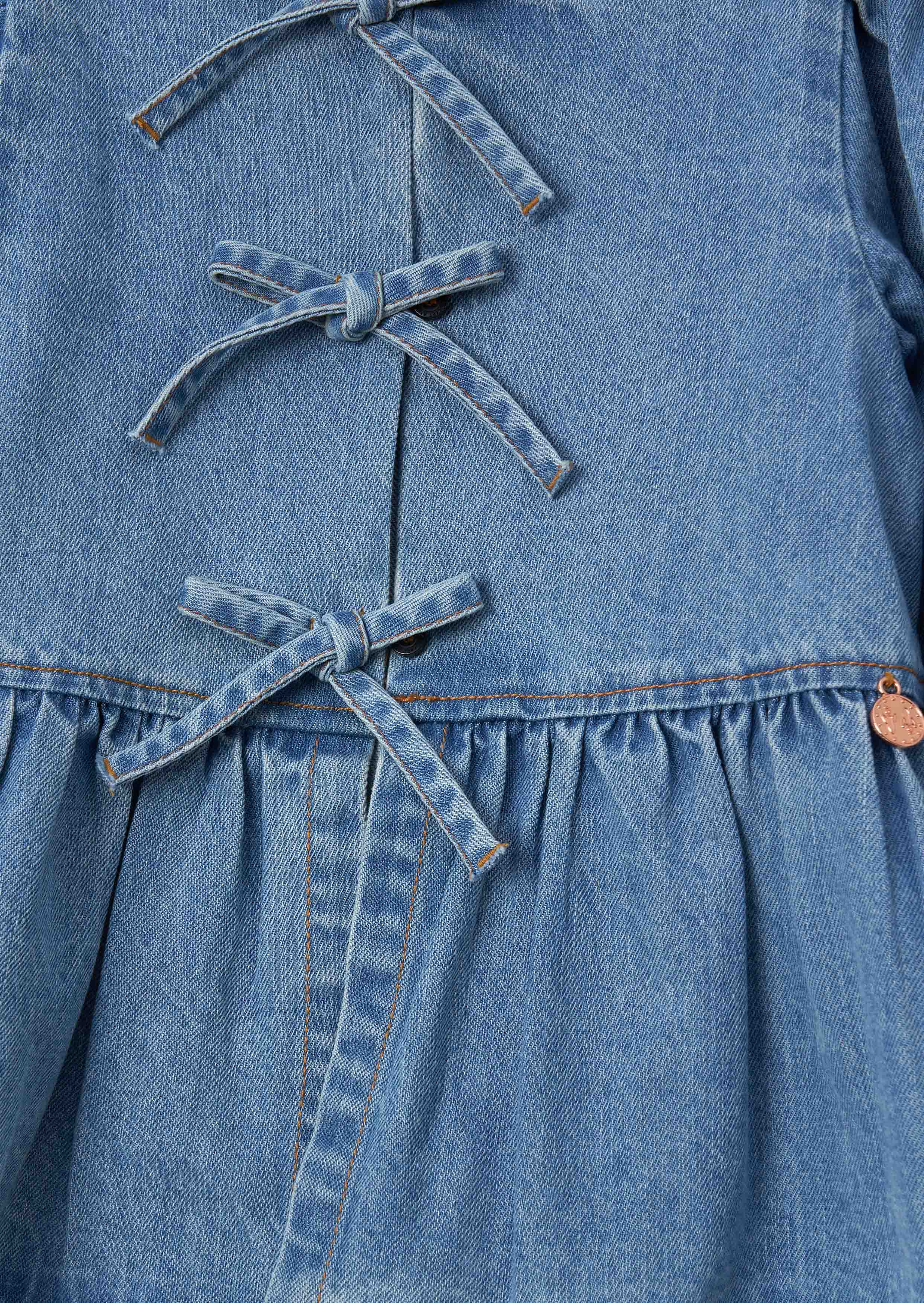 Rochelle Blue Denim Peplum Bow Top